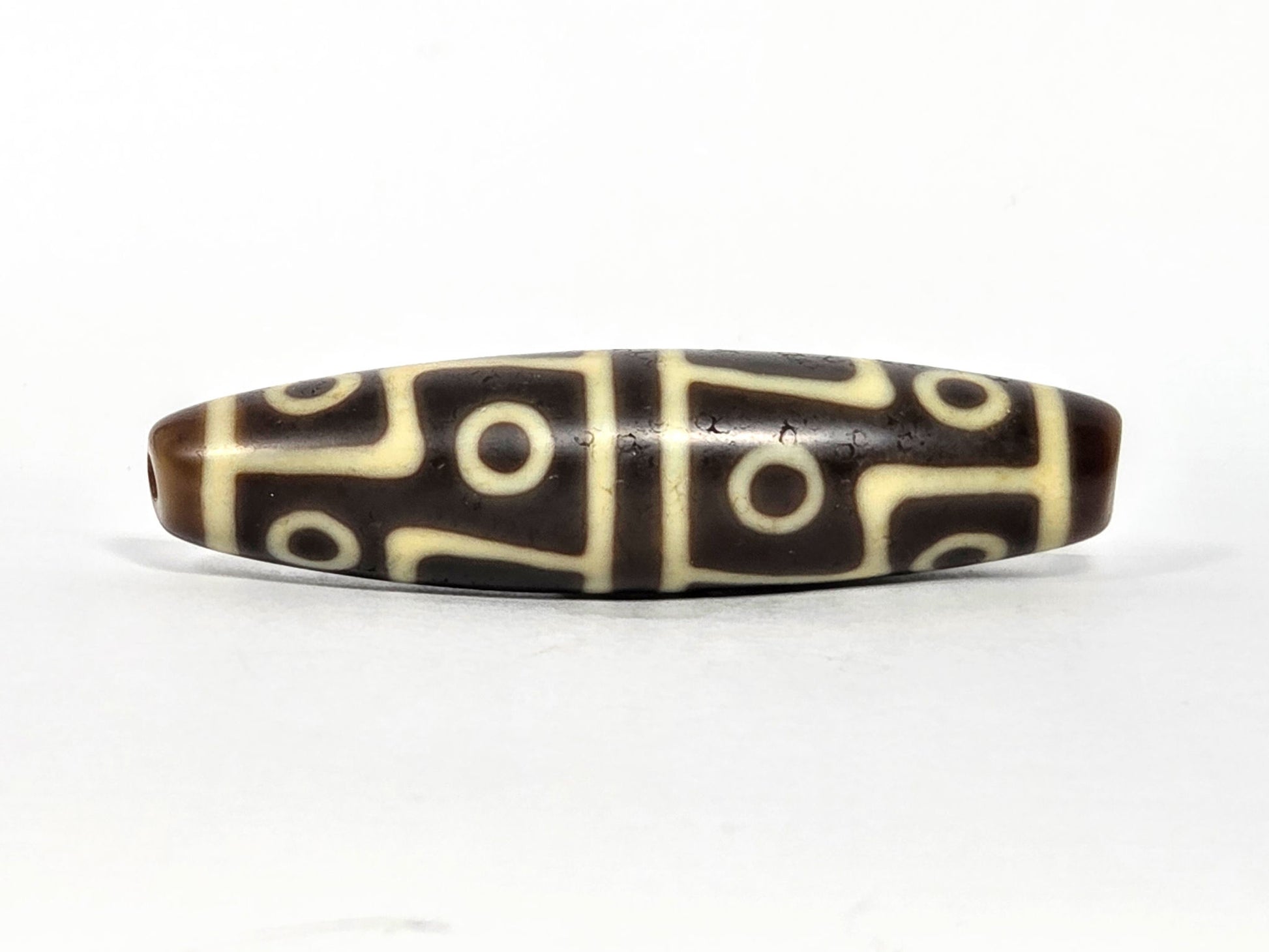 Ac-070826-12E ancient twelve eye dzi bead chocolate-brown agate third face angled with drill end visible unretouched