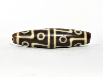 Ac-070826-12E ancient twelve eye dzi bead chocolate-brown agate third face angled with drill end visible unretouched
