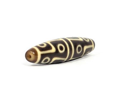 Ac-070826-12E ancient twelve eye dzi bead opposite drill end angled view chocolate-brown agate full profile unretouched