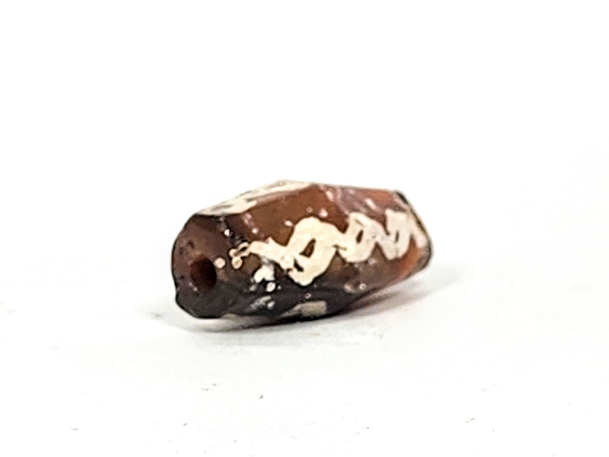 Ac-032425-LK opposite end, pronounced ancient bore weathering, orange-brown carnelian, chain links visible, unretouched