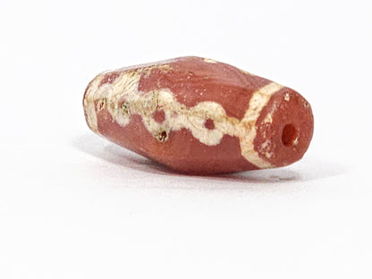 Ac-050725-LKBS angled end view, drill hole, warm terracotta carnelian end cap, links wrapping body, unretouched