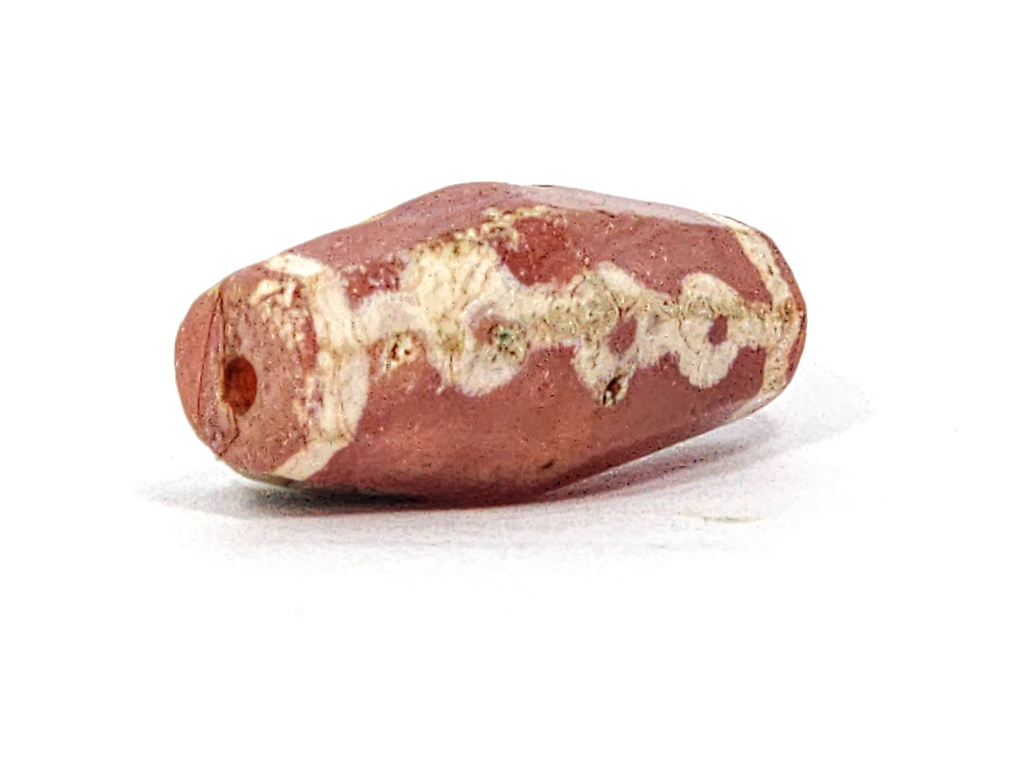 Ac-050725-LKBS opposite end drill hole, matte carnelian surface, links band visible, terracotta-red, unretouched