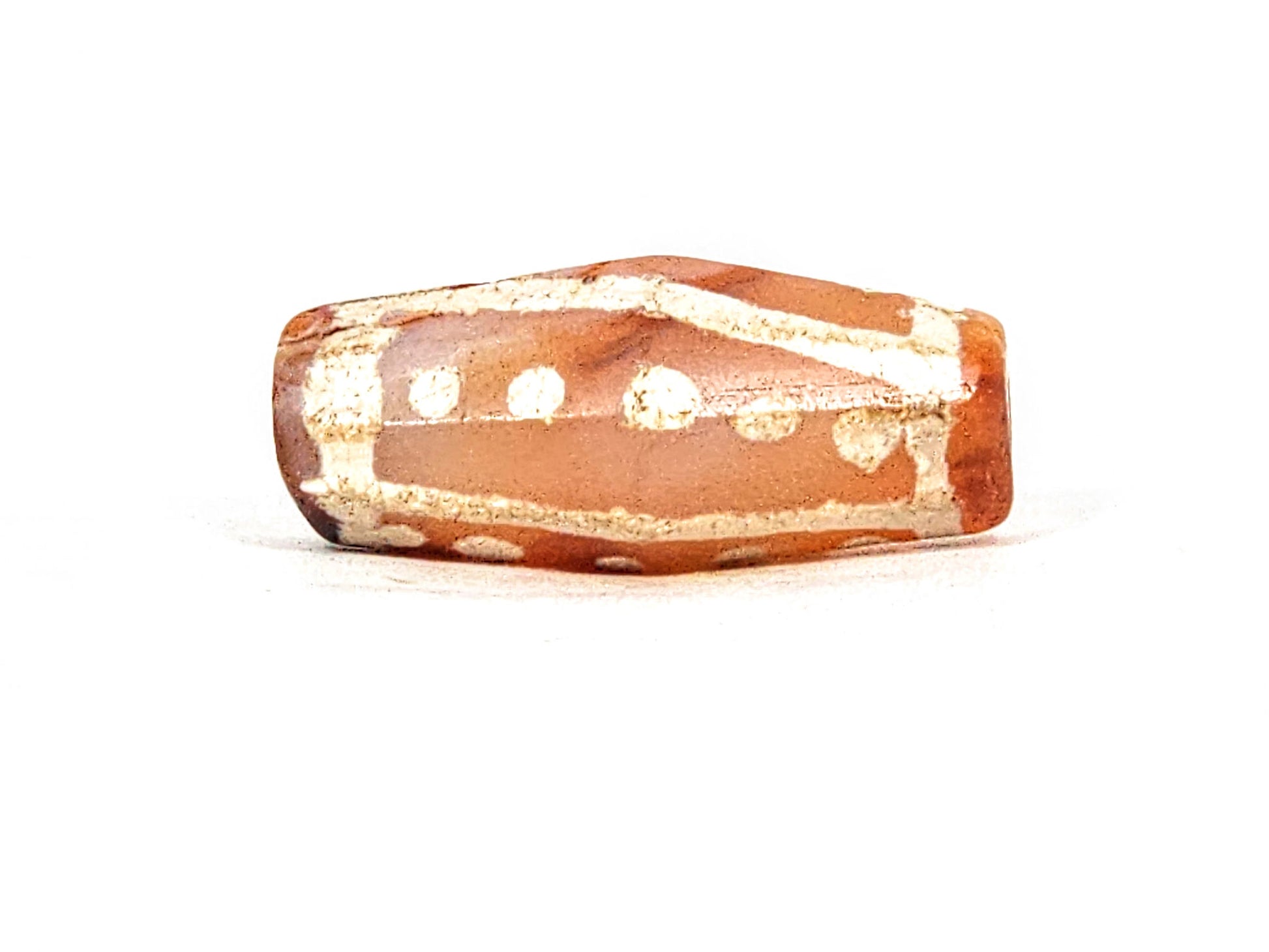 Ac-030625-20S face D, star dots on primary and transitional faces, warm orange-brown carnelian banding, unretouched