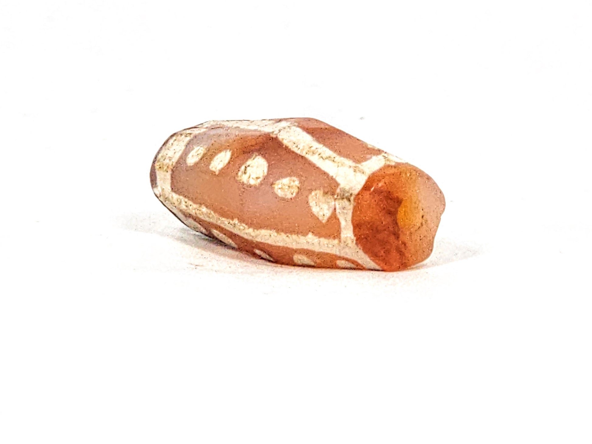 Ac-030625-20S angled end, large funnel drill hole, vivid orange-red end cap, star dots wrapping body, unretouched