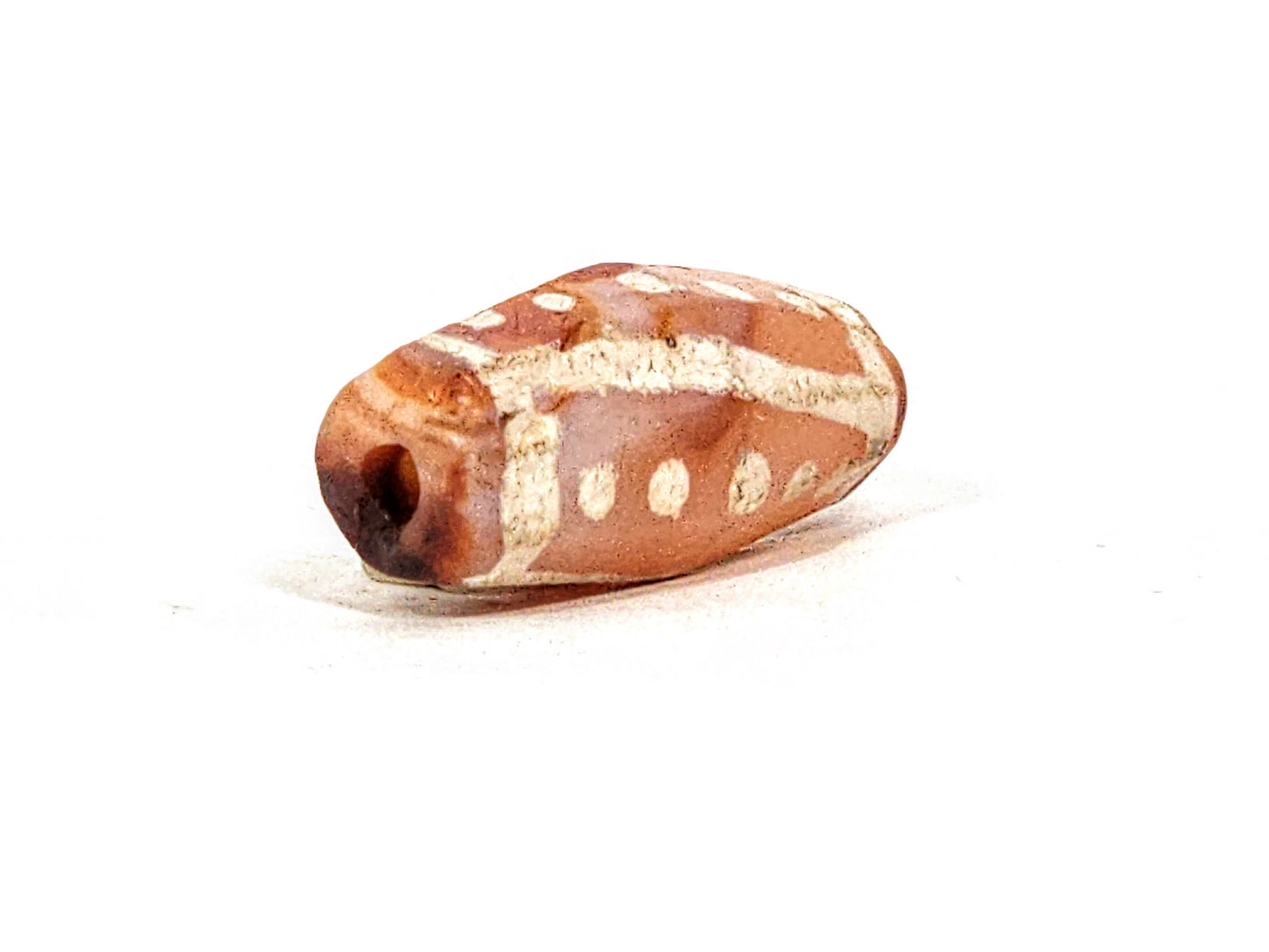 Ac-030625-20S opposite end angled, funnel bore, vivid orange-red end cap, star dot rows on body faces, unretouched