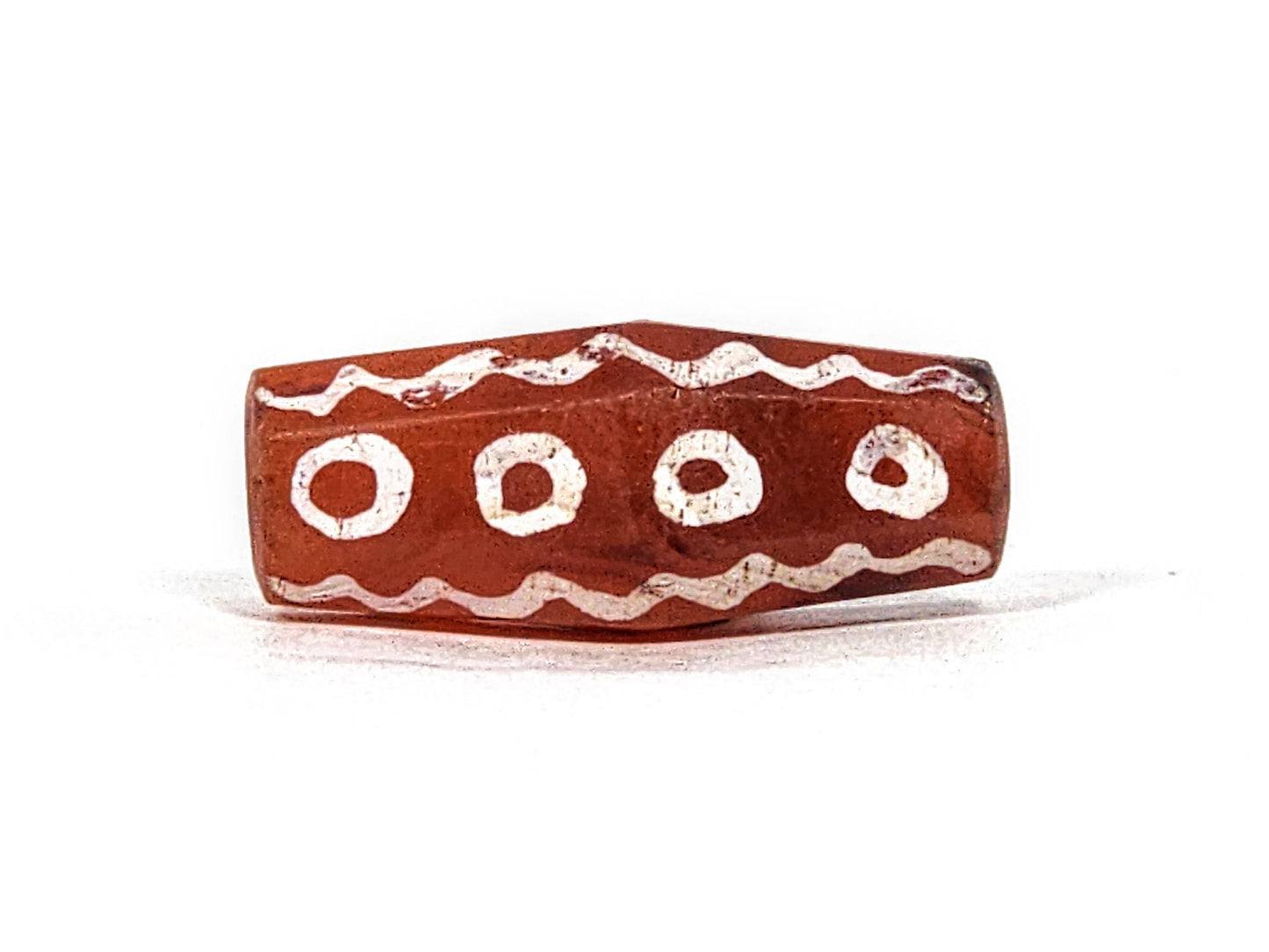Ac-010825-16EW face B, 4 ring eyes in row, wave bands above and below, terracotta-red octagonal flat face, unretouched