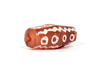 Ac-010825-16EW opposite end, drill hole, ring eyes on upper face, wave band, warm terracotta carnelian, unretouched
