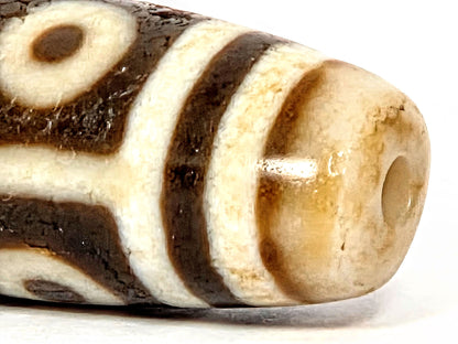 Ac-070926-9E ancient nine eye dzi close-up drill end warm golden-honey end cap surface age texture unretouched