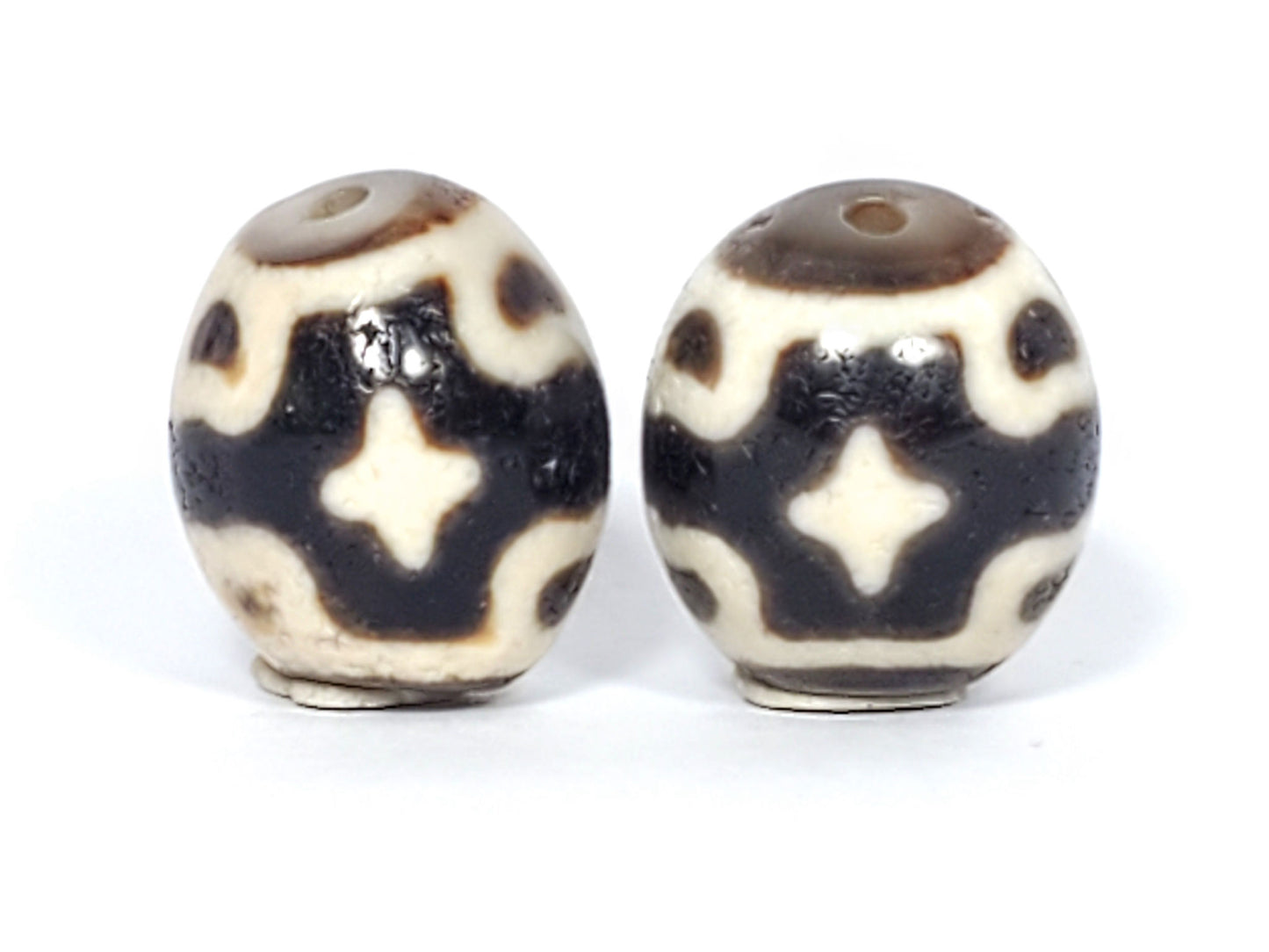 Ac-020124-6ELC pair ancient six eye lotus cross dzi, third face view, lotus eye composition visible, unretouched