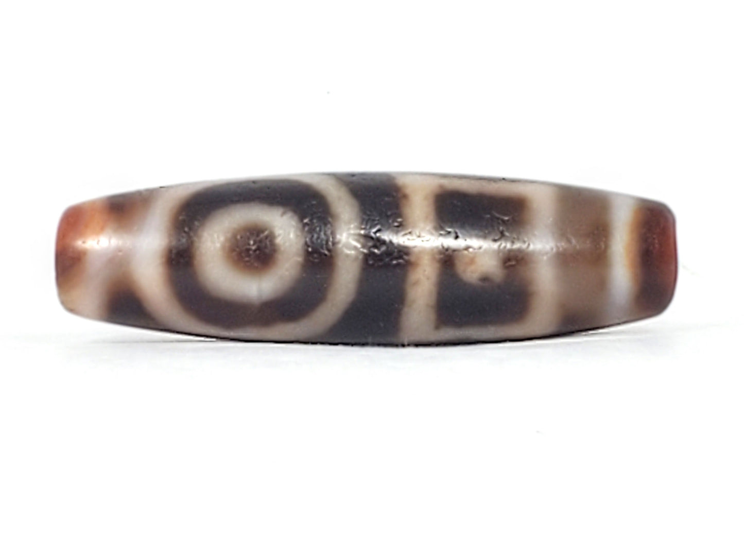 Antique heaven earth gate dzi — Face A, round eye with concentric rings, brown centre spot, warm agate ends, At-0426-DHE
