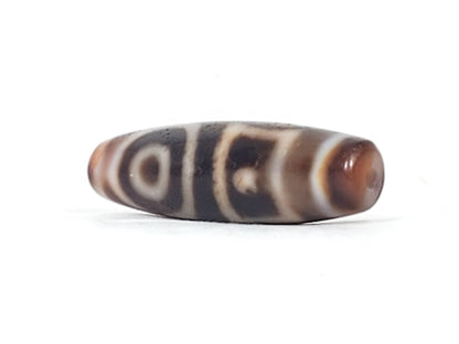 Antique heaven earth gate dzi — angled end, drill hole at tip, warm brown agate cap, eye and stripe motif, At-0426-DHE
