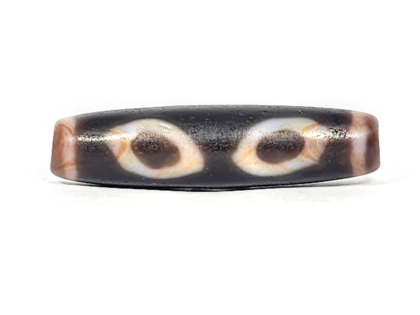 Ac-030525-3E ancient three eye dzi 50.8×12.9mm pitch-black, two honey-orange inner ring eyes Face A, unretouched