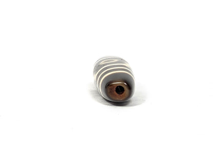 Ac-070926-THE ancient three eye dzi direct drill-end view oval cross-section warm honey-brown drill channel unretouched