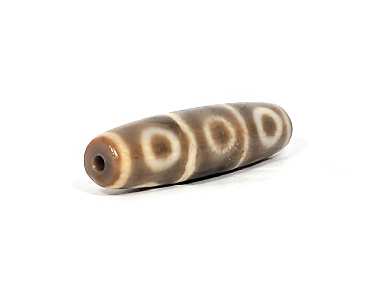Ac-071026-8E ancient eight eye dzi angled view drill end B warm end cap three eyes visible unretouched