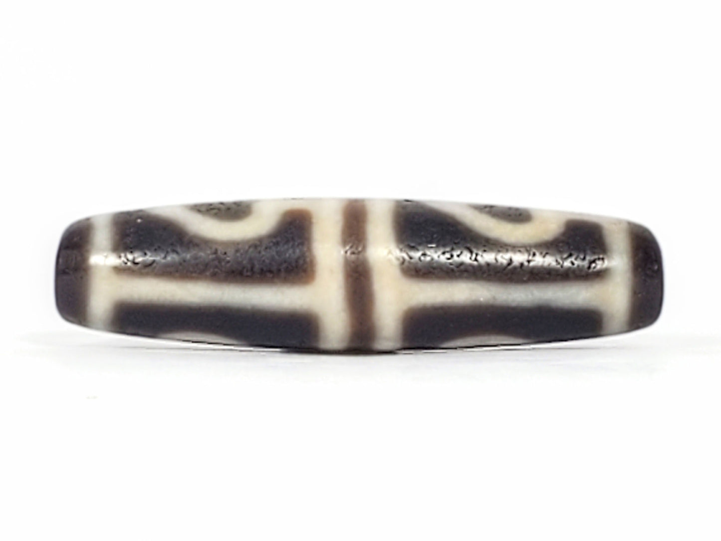 Ac-061826-FLB2 upper connector face, T-bar cream-white bands, matte granular weathered dark ground disclosed, unretouched