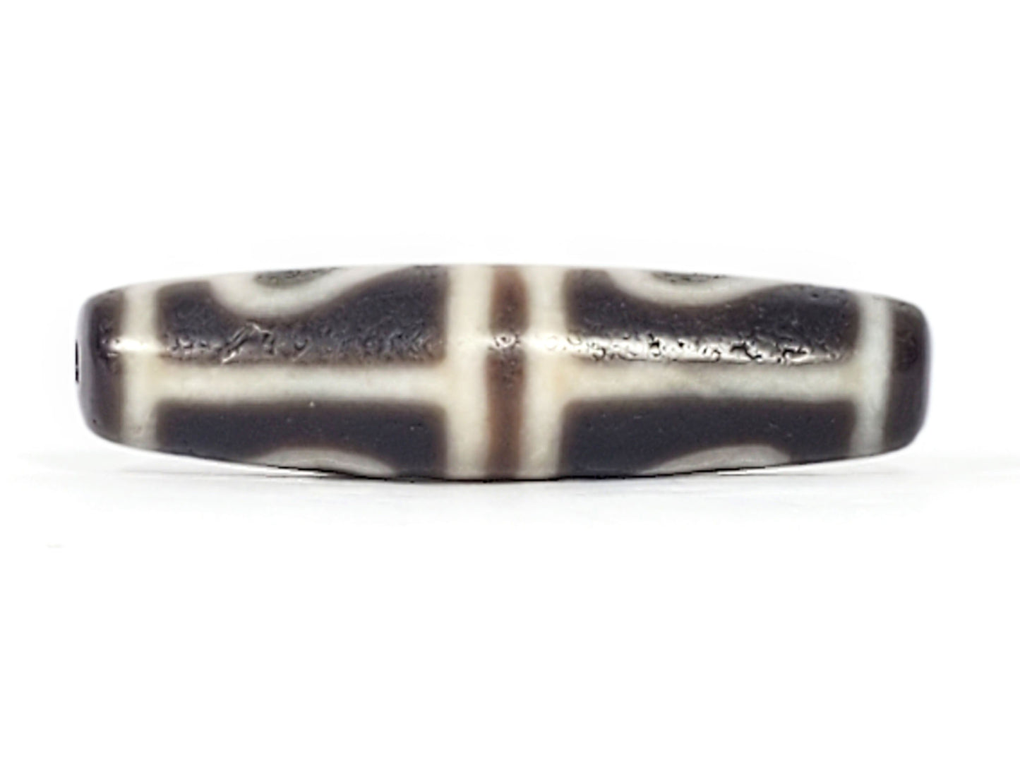 Ac-061826-FLB2 lower connector face, pronounced matte micro-pitting on dark grey-brown ground, 800+ yrs disclosed, unretouched