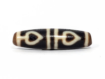 Ac-070625-FLB3 ancient four leaf bodhi dzi 47.6×12.6mm Face A, pitch-black ground bold cream-white leaves, unretouched