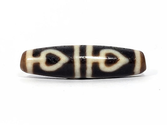 Ac-070625-FLB3 ancient four leaf bodhi dzi 47.6×12.6mm Face A, pitch-black ground bold cream-white leaves, unretouched