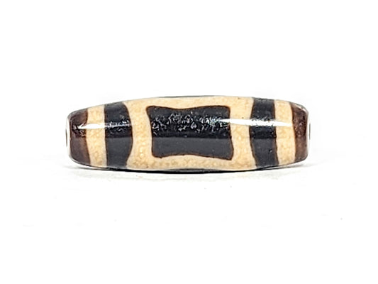 Rare ancient Heaven Earth motif Dzi bead with black and cream agate stripes, bloodspots, and natural patina