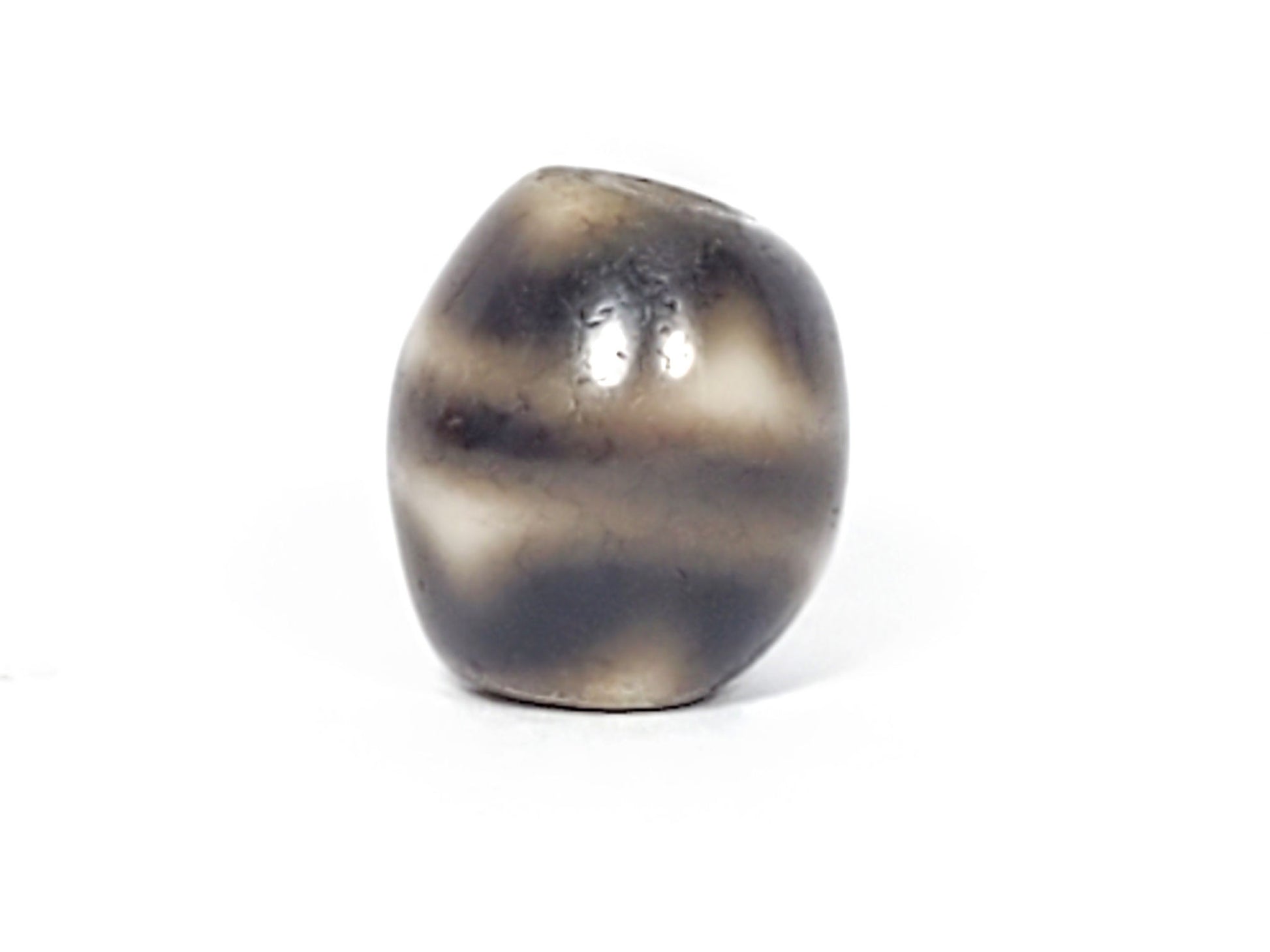 Ac-021724-TT ancient round tiger tooth dzi, second face view, tooth element visible, grey-brown ground, unretouched