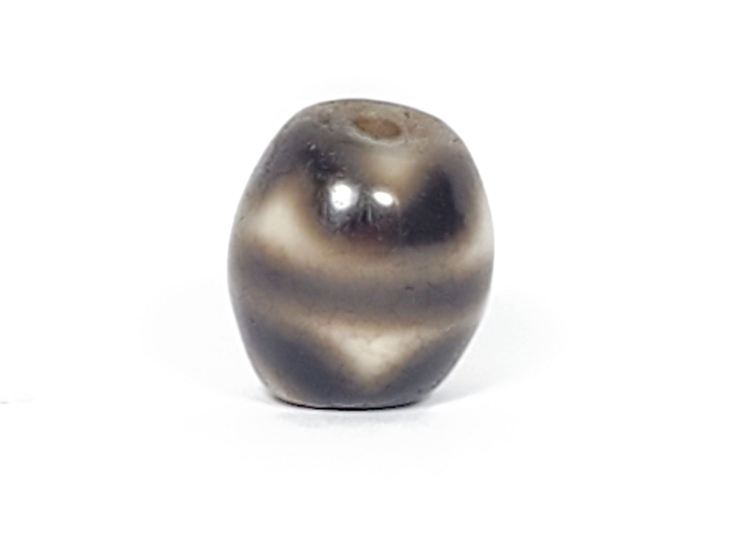 Ac-021724-TT ancient round tiger tooth dzi, third face view, drill hole visible top, unretouched