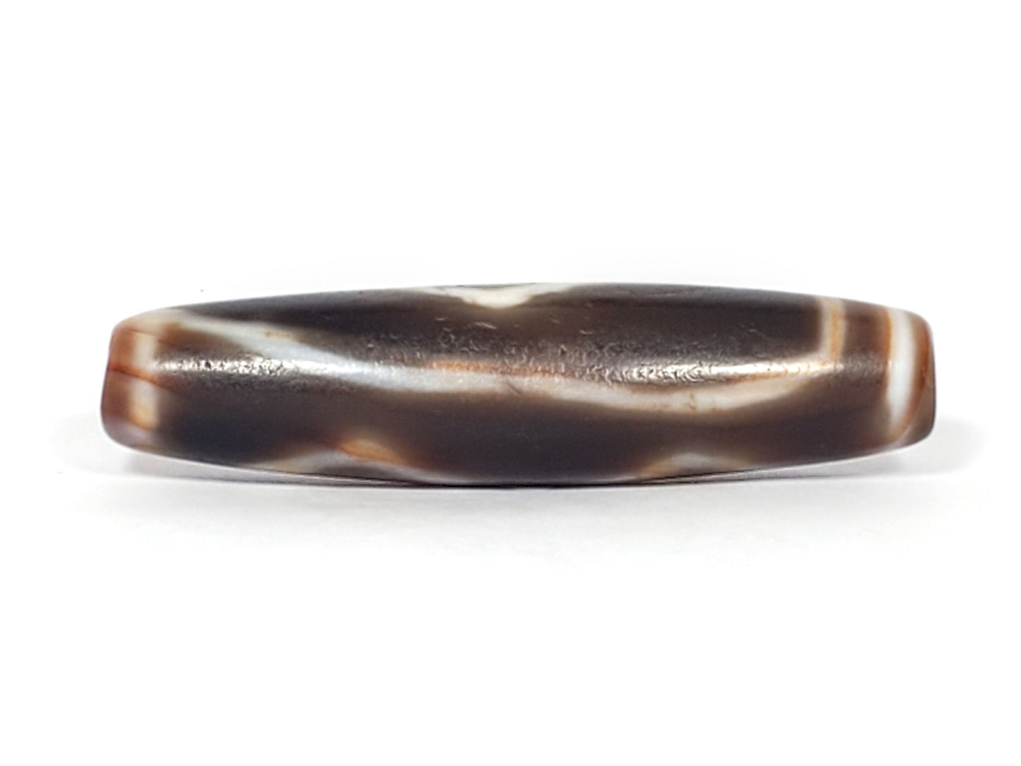 At-061926-3DE2 connector face, flowing wave band, dark brown ground, age micro-pitting, unretouched