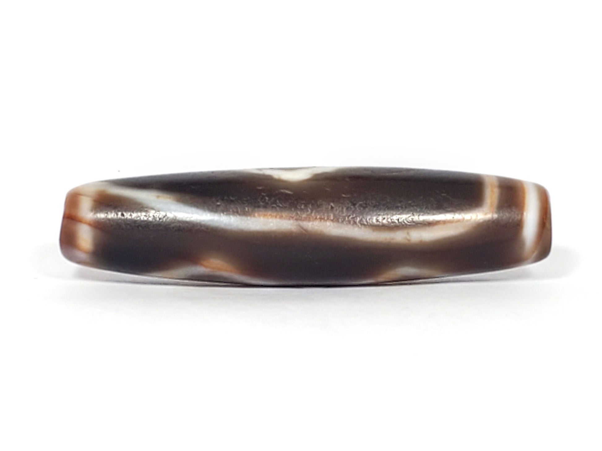 At-061926-3DE2 connector face, flowing wave band, dark brown ground, age micro-pitting, unretouched