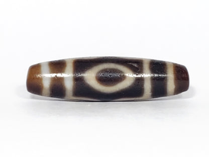 Real Tibetan dzi bead with three eye motif.  This dzi bead is extremely old.  It is a powerful dzi bead with a lot of dzi energy.