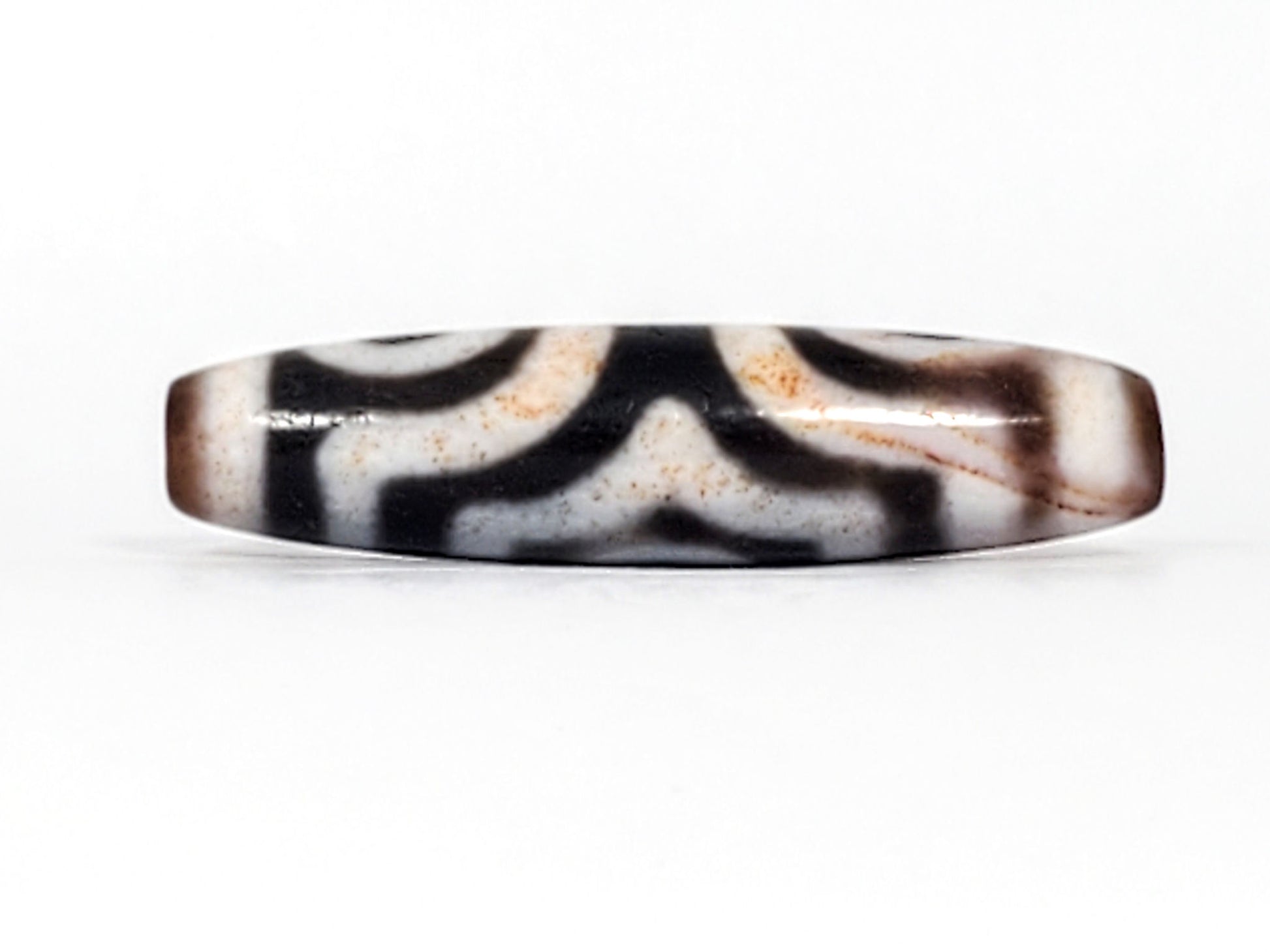 Fourth view of antique Three Eye Dzi bead showing tapered end profile — 47.8mm × 11.8mm natural black agate, cinnabar bloodspot bead