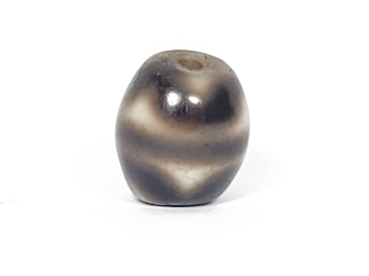 Ac-021724-TT ancient round tiger tooth dzi, third face view, drill hole visible top, unretouched