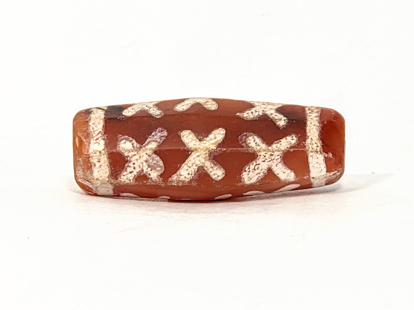 Ac-062426-12X ancient twelve X-cross carnelian dzi 28.5x11.0mm octagonal flat face showing six X-forms unretouched