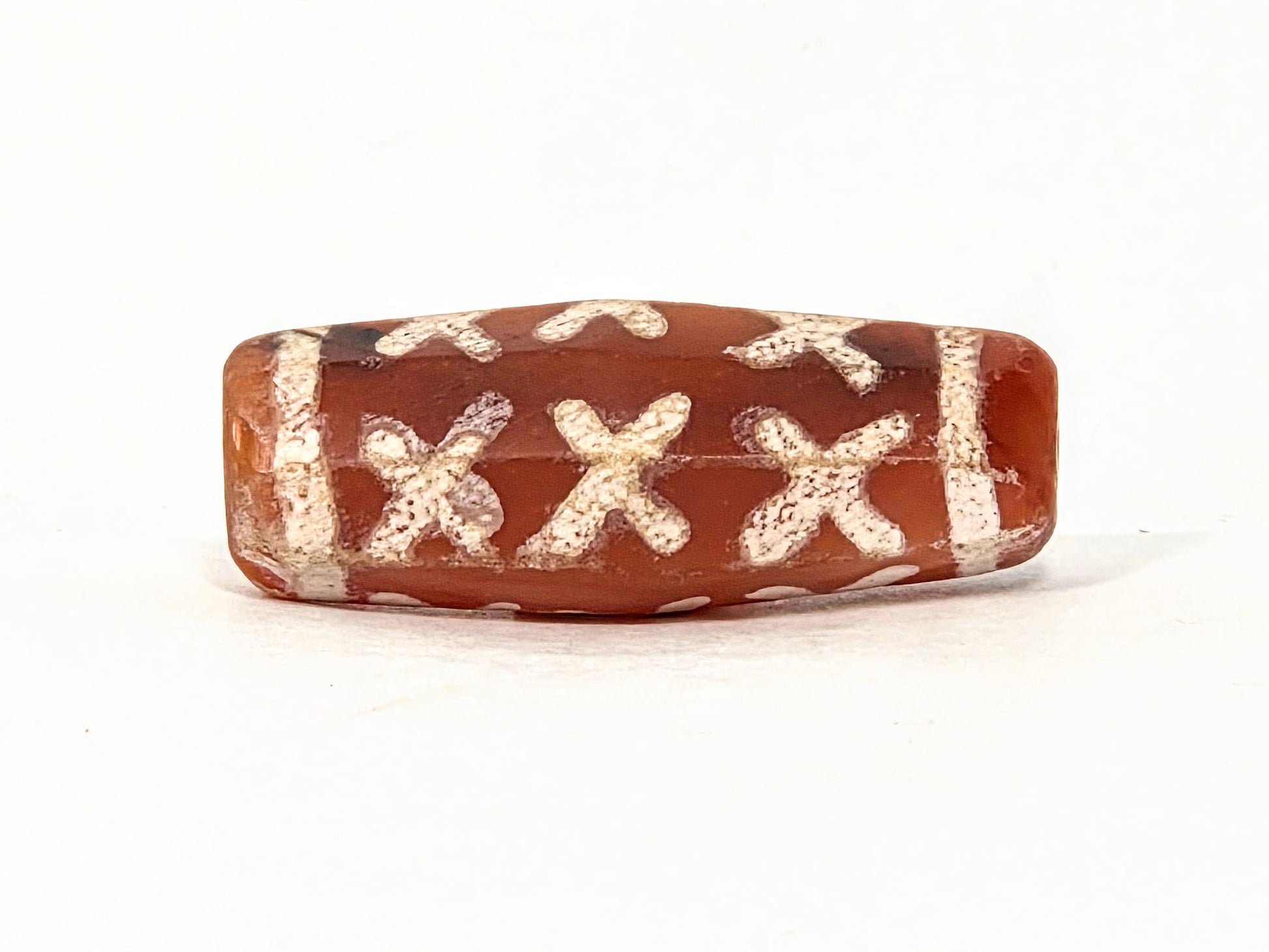 Ac-062426-12X ancient twelve X-cross carnelian dzi 28.5x11.0mm octagonal flat face showing six X-forms unretouched