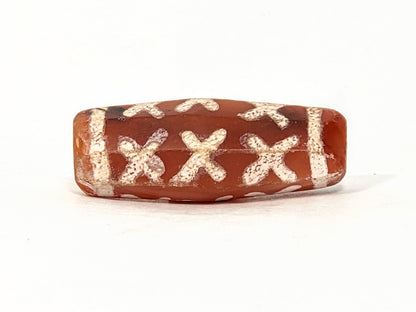 Ac-062426-12X ancient twelve X-cross carnelian dzi 28.5x11.0mm octagonal flat face showing six X-forms unretouched