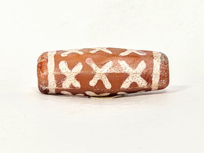 Ac-062426-12X ancient twelve X-cross carnelian dzi 28.5x11.0mm fourth face broad barrel form unretouched