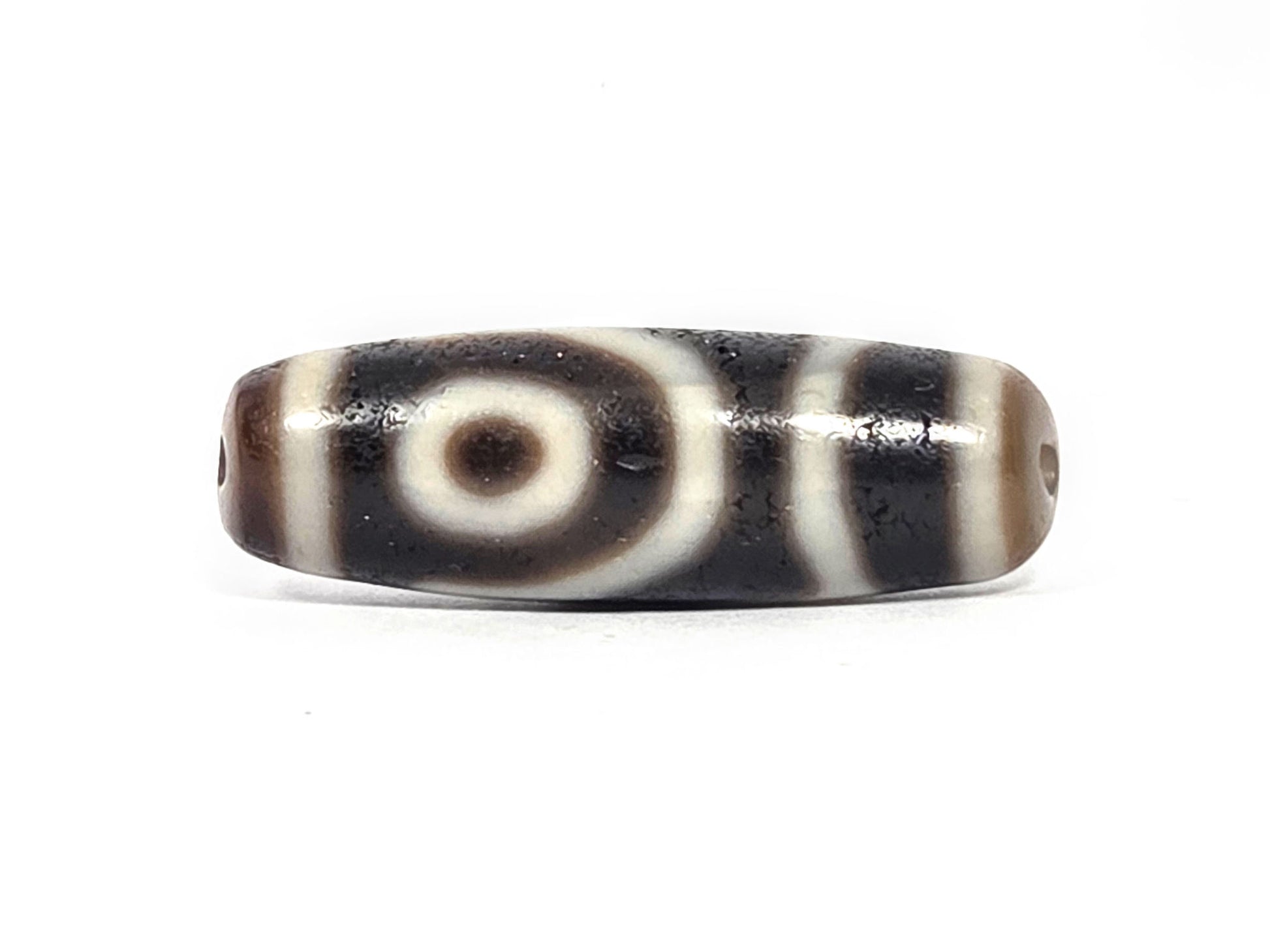Ac-073026-2E ancient two eye dzi pitch-black agate face B second eye both drill holes visible unretouched