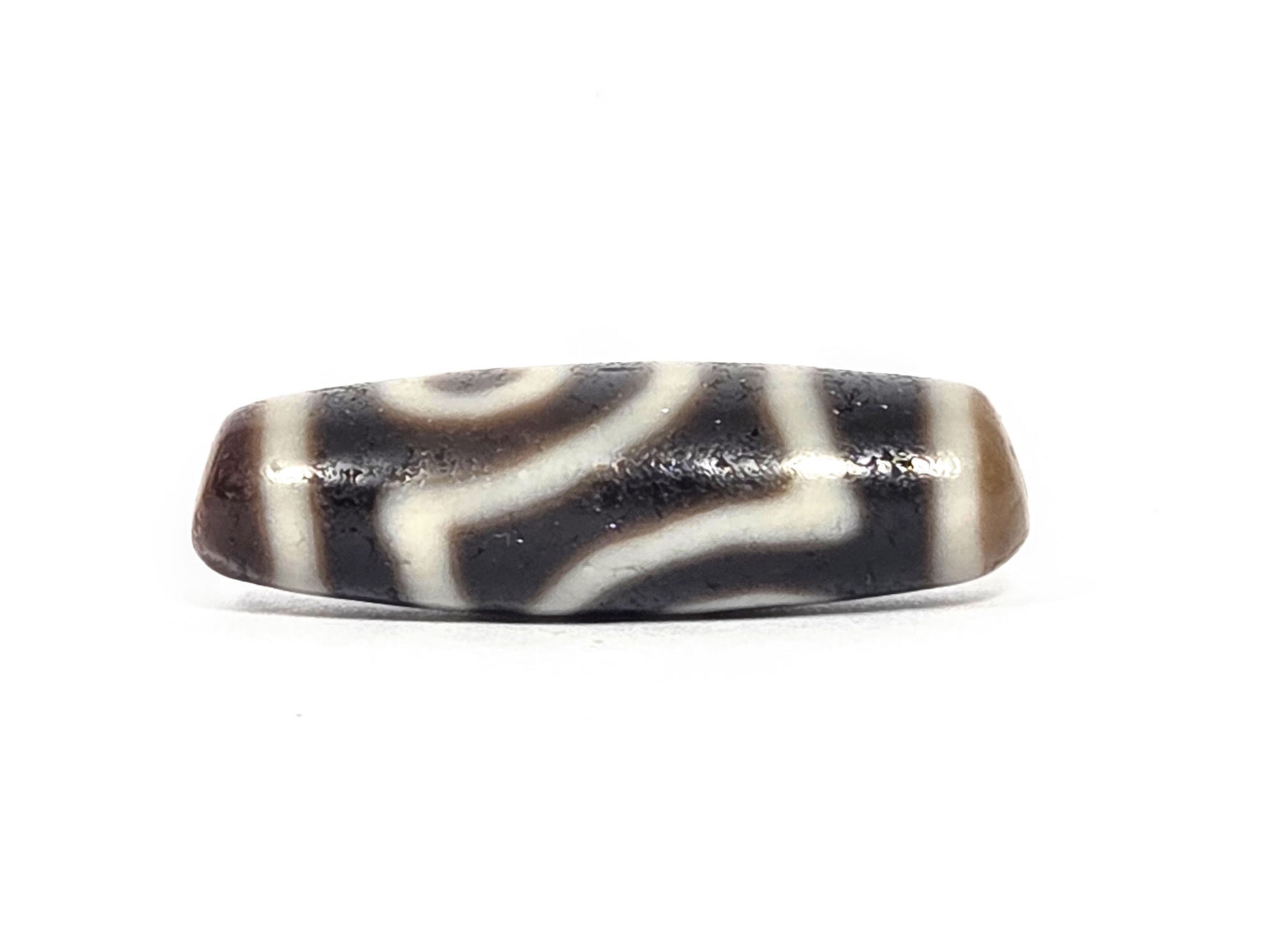 Ac-073026-2E ancient two eye dzi pitch-black agate connector face angled view wave line pattern unretouched