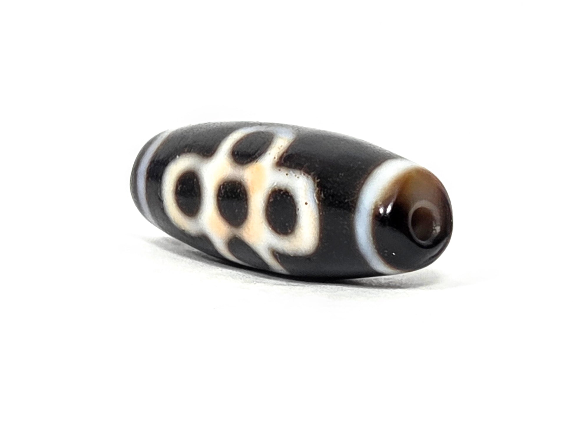 At-062026-5ELT angled view, eye cluster and end cap, warm brown drill