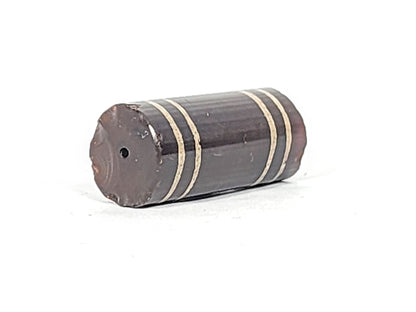 Ac-061426-4Str, left end showing moderate chip and fracture line, drill hole intact, deep grey-brown, unretouched