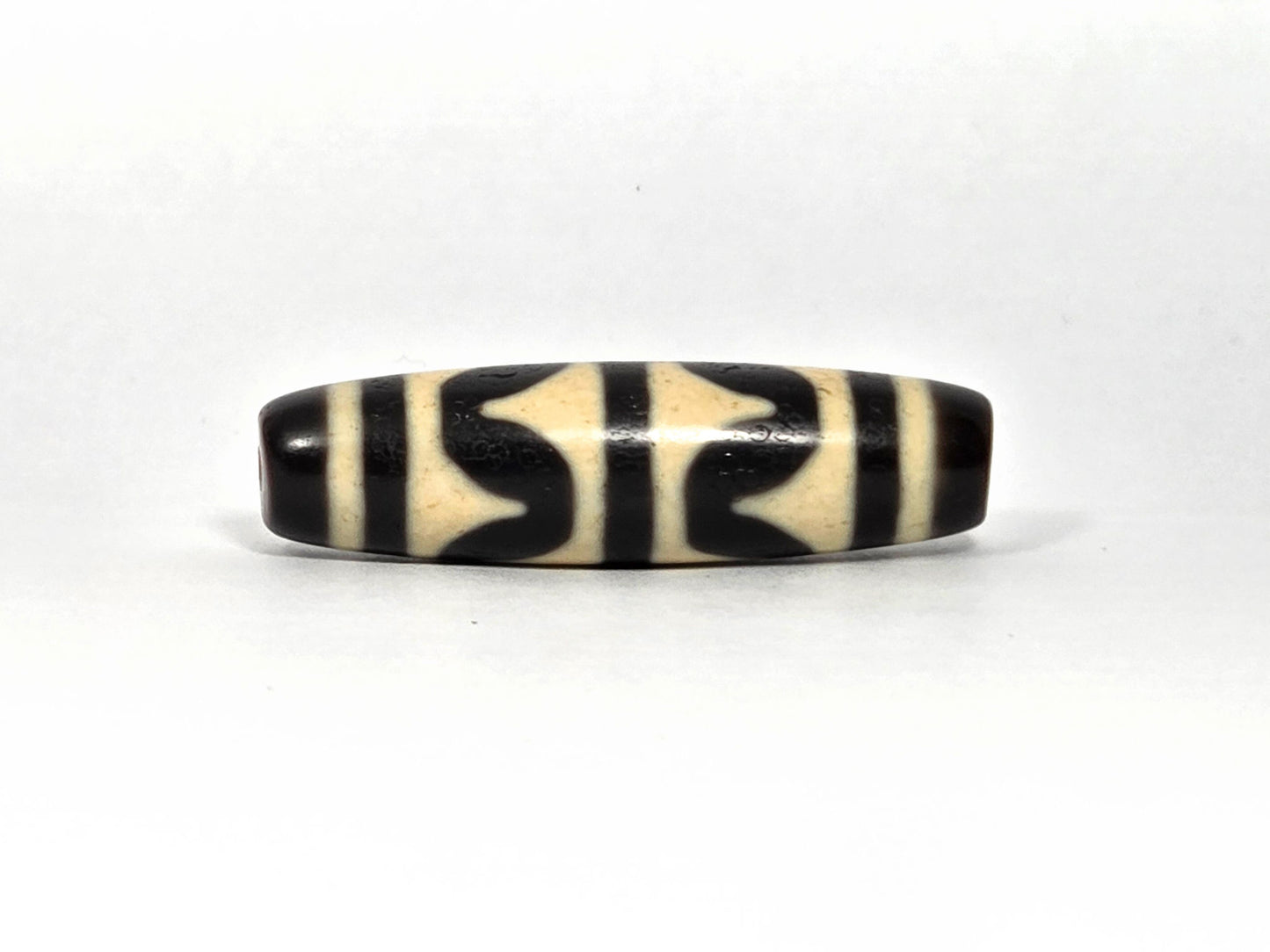 At-090226-DW8 antique double wave dzi cream black agate third rotation narrow profile, unretouched
