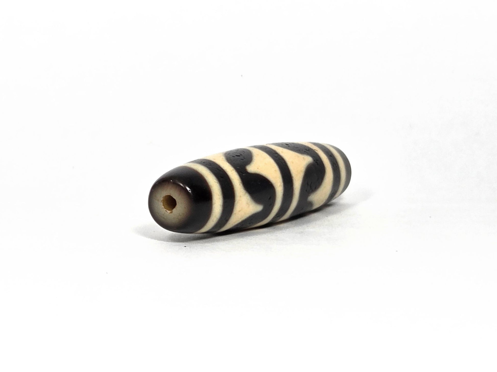 At-090226-DW8 antique double wave dzi cream black agate angled opposite drill end wave detail, unretouched