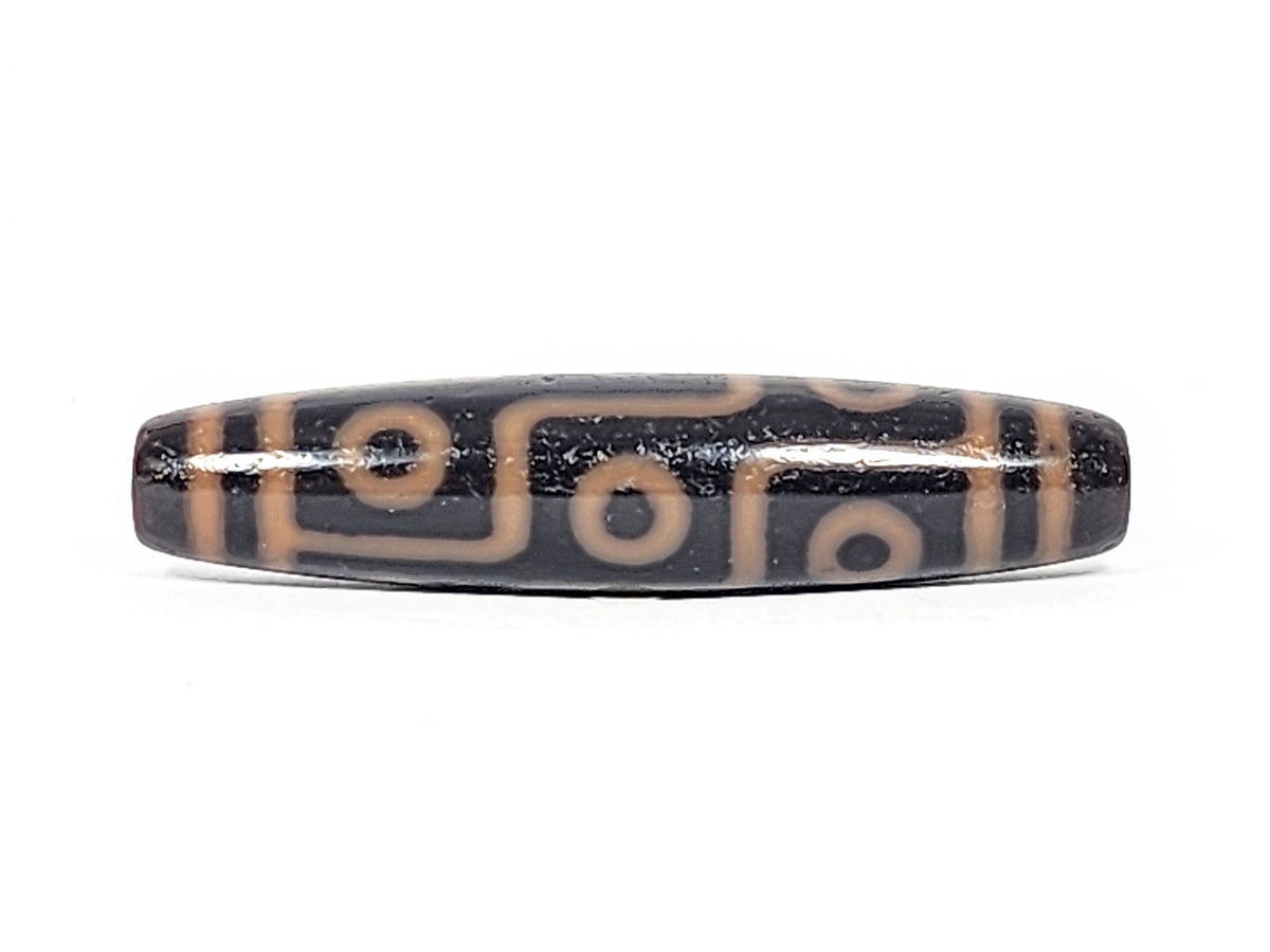 Third angle of antique nine eye dzi At-012325-9E4, warm amber-orange nine eye motif on deep dark brown natural agate, longest nine eye in collection, unretouched