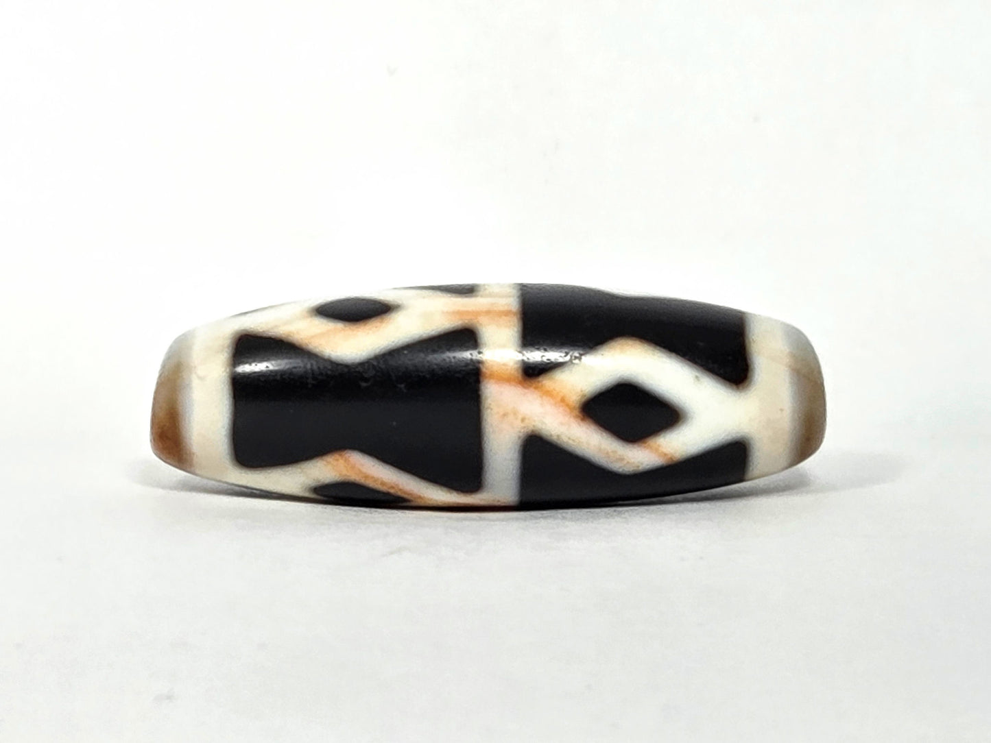 At-062126-6DE dzi bead, straight side profile, diamond eyes and H-bar dividers, unretouched