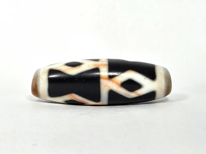 At-062126-6DE dzi bead, straight side profile, diamond eyes and H-bar dividers, unretouched