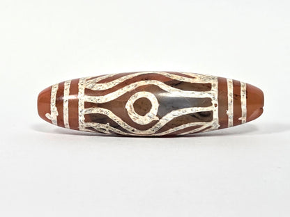 At-061426-2ETTSt carnelian dzi, 52.2×15.1mm, Face A, circular eye + tiger tooth waves, terracotta-red, unretouched