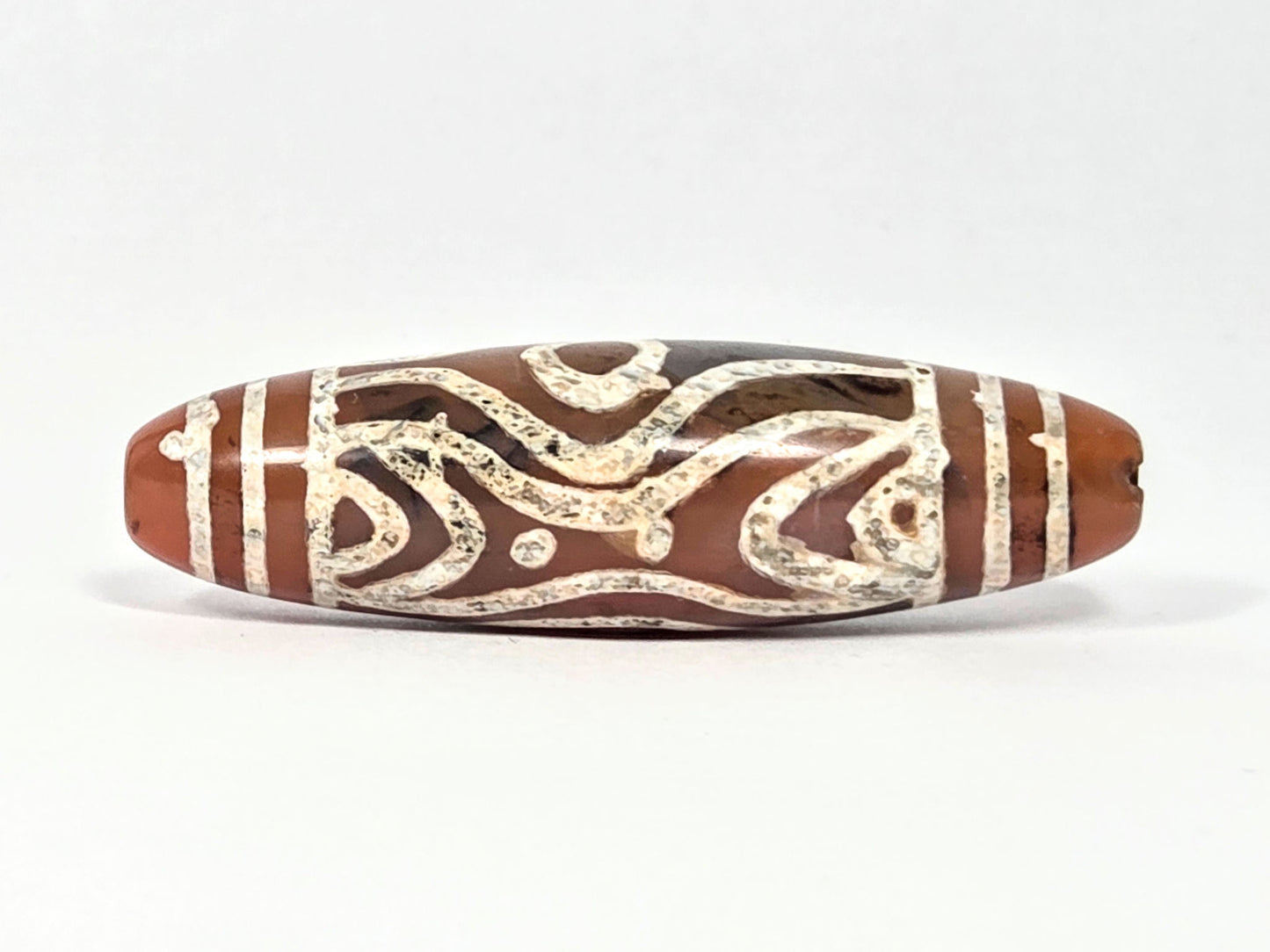 At-061426-2ETTSt carnelian dzi, Face B, tiger tooth arch + star dot elements, dark banding, unretouched
