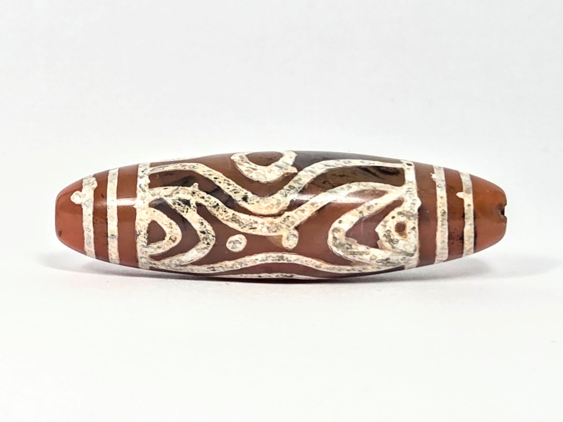 At-061426-2ETTSt carnelian dzi, Face B, tiger tooth arch + star dot elements, dark banding, unretouched