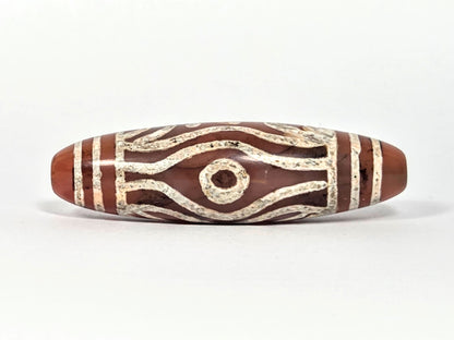 At-061426-2ETTSt carnelian dzi, Face C, second circular eye, open eye form, warm terracotta ground, unretouched