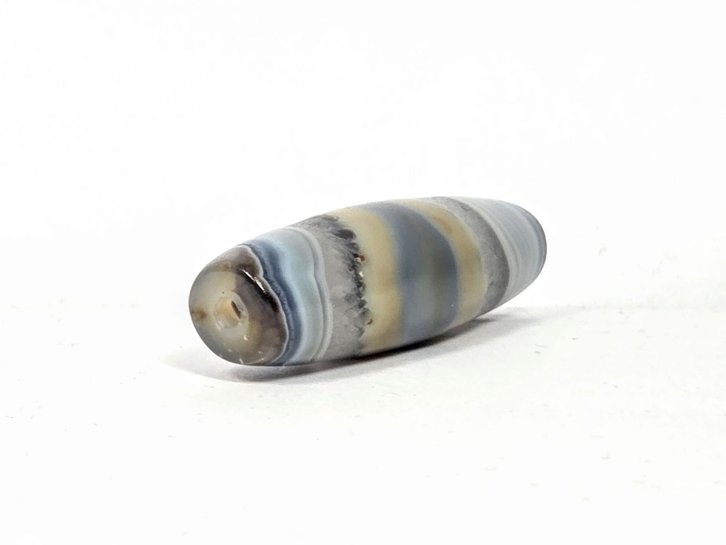 At-N-013126-1E angled view, opposite end cap, mineral particle disclosed