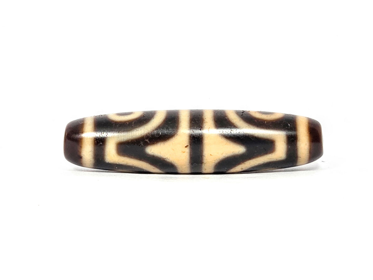 Antique Four Eye Tiger Tooth dzi bead, tiger tooth face showing two pointed diamond star forms, At-082525-4ETT