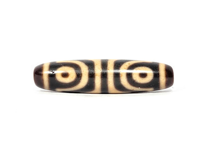 Second eye face of antique Four Eye Tiger Tooth dzi bead showing two concentric-ring eyes, cream agate, At-082525-4ETT